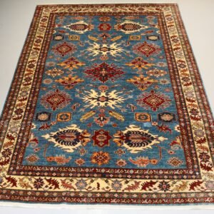 "Handcrafted Afghani carpet with intricate designs and vibrant colors."