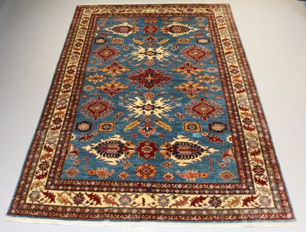 "Handcrafted Afghani carpet with intricate designs and vibrant colors."