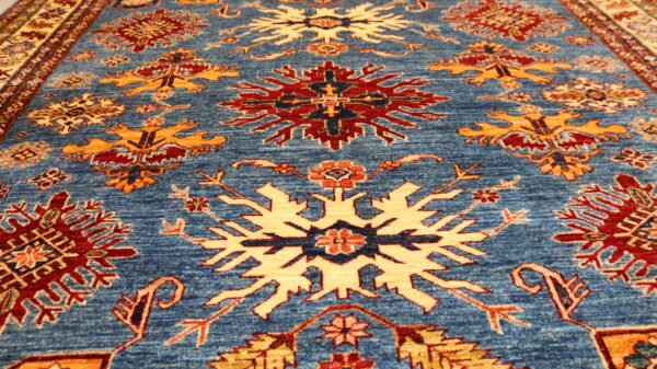 "Handcrafted Afghani carpet with intricate designs and vibrant colors."