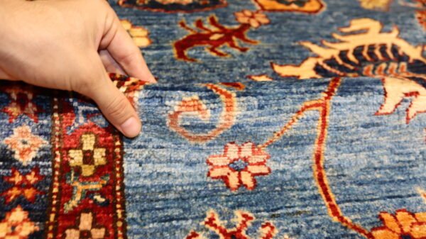 "Handcrafted Afghani carpet with intricate designs and vibrant colors."