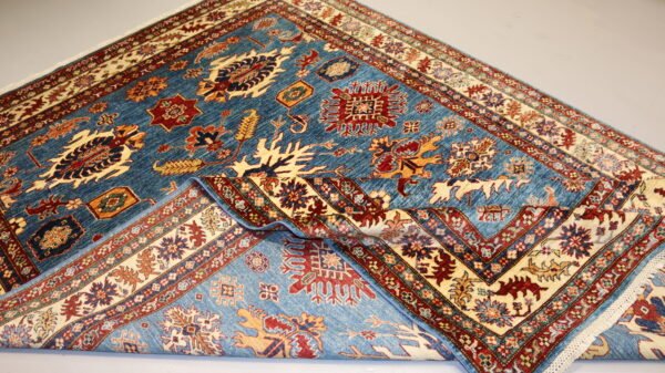 "Handcrafted Afghani carpet with intricate designs and vibrant colors."