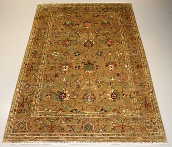 “Handmade Afghan carpet with golden brown background and intricate floral patterns, showcasing traditional craftsmanship.”