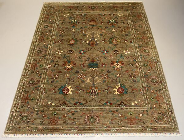 “Handmade Afghan carpet with intricate floral design in earth tones, crafted with traditional artistry.”