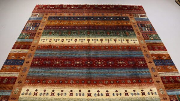 Stock #AR-2319 – Size: 304 x 208 CM (9.9 x 6.8 FT) Vibrant multicolored traditional design featuring rich reds, earthy tones, and intricate patterns. - Image 4