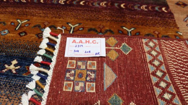 Stock #AR-2319 – Size: 304 x 208 CM (9.9 x 6.8 FT) Vibrant multicolored traditional design featuring rich reds, earthy tones, and intricate patterns. - Image 9
